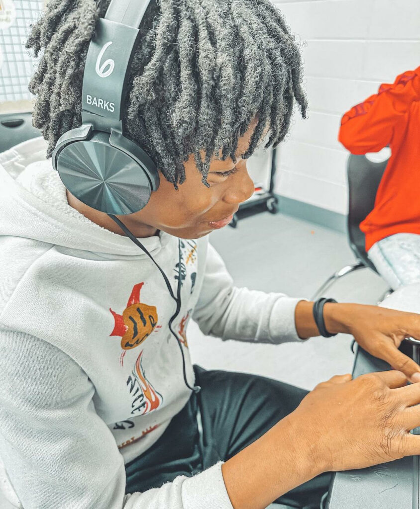 A student using Barks Headphones to listen to audio with great sound quality